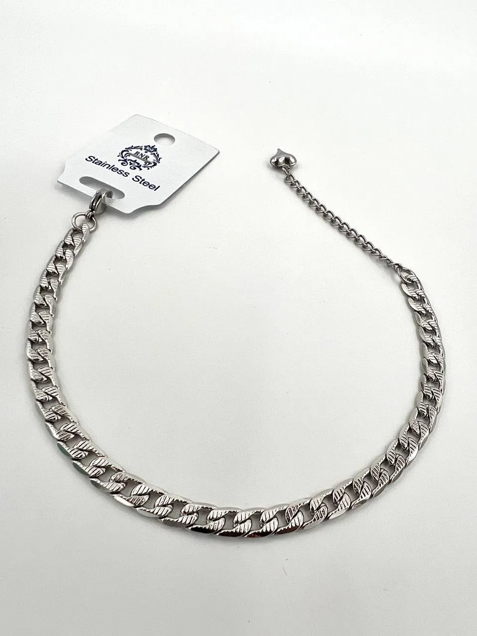 پابند زنانه طرح کارتیر تراش دار جنس استیل برند Stainless Steel رنگ سفید